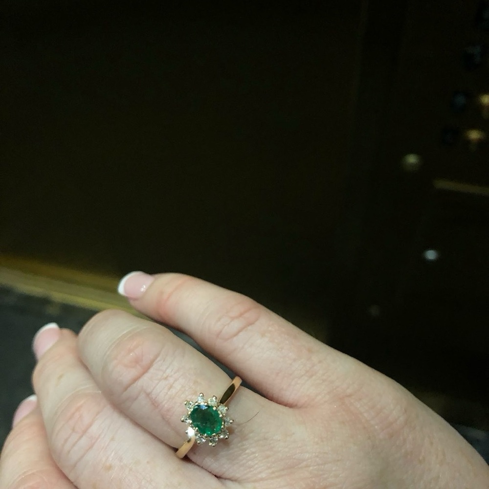 Solid gold emerald ring with starburst diamonds